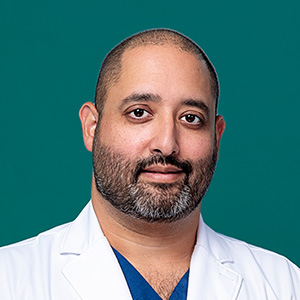Male doctor professional headshot.