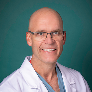 Male orthopedics doctor headshot.