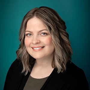 Female nurse practitioner professional headshot.