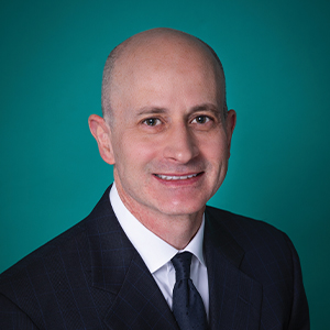 Professional headshot of male radiology doctor.