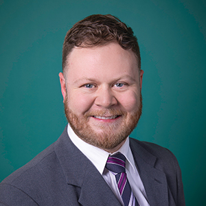 Male trauma & acute care surgery physician assistant headshot