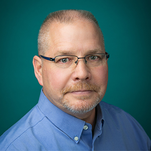 Male occupational therapist professional headshot.