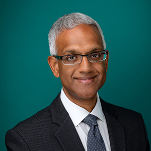 Male doctor professional headshot.