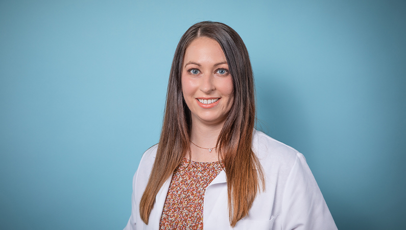 Stylized professional headshot for female advanced practice registered nurse in dermatology.