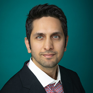 Male ophthalmologist smiling in professional headshot