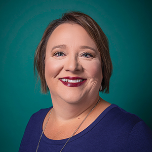 Female family medicine nurse practitioner headshot.