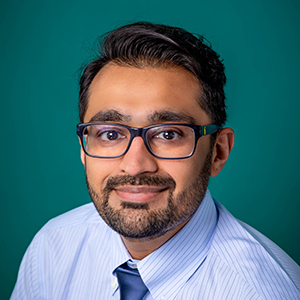Professional headshot of male doctor.