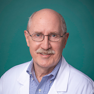 Male family medicine doctor headshot.