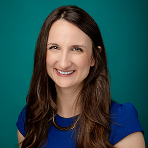 Female dermatologist professional headshot.