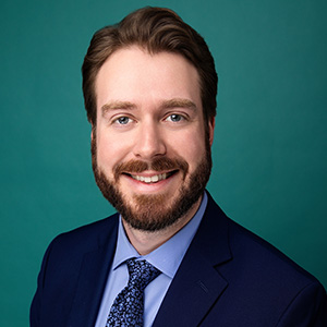 Male CRNA smiling in professional headshot