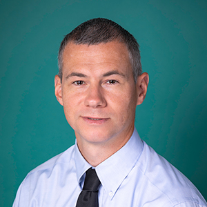 Male nurse practitioner professional headshot.