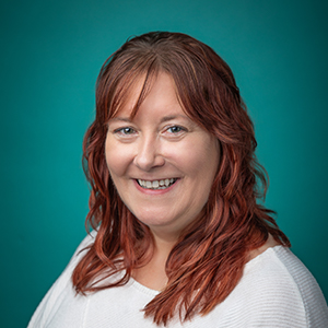 Female nurse smiling in professional headshot