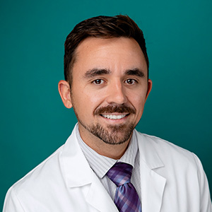 Male general surgery doctor professional headshot.