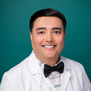 Male neurologist professional headshot.