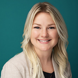 Female physician assistant smiling in professional headshot.