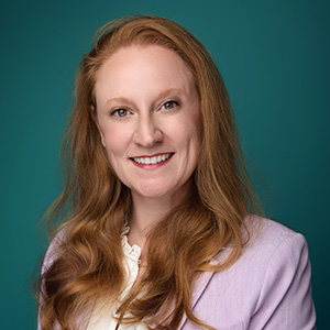 Female physician assistant smiling in professional headshot.