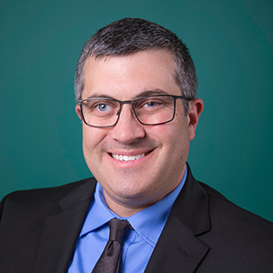 Male trauma & acute care surgery nurse practitioner headshot