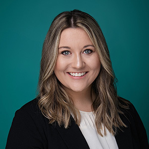 Female nurse practitioner smiling in headshot.
