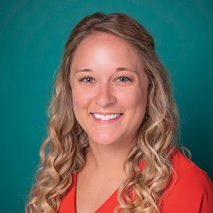 Female family medicine nurse practitioner headshot.