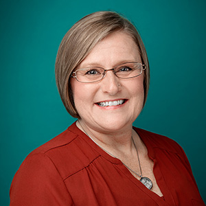 Female nurse practitioner professional headshot.